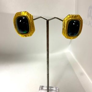 Beautiful clip earrings with step down gold backing and dark green cabochons.